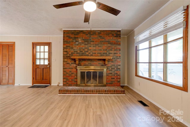 3043 Charles Rd, Shelby, NC 28152 - unfurnished living room with crown molding, wood finished floors, plenty of natural light, a ceiling fan, and baseboards