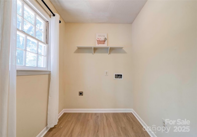 3043 Charles Rd, Shelby, NC 28152 - laundry room with light wood-style floors, electric dryer hookup, and baseboards