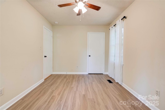 3043 Charles Rd, Shelby, NC 28152 - unfurnished bedroom featuring light wood-type flooring, baseboards, and a ceiling fan
