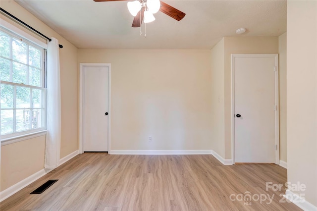 3043 Charles Rd, Shelby, NC 28152 - empty room with wood finished floors, a ceiling fan, and baseboards