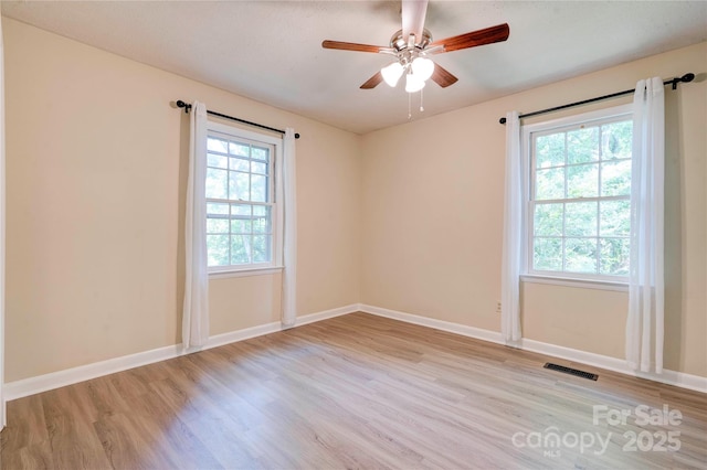 3043 Charles Rd, Shelby, NC 28152 - empty room featuring light wood-style flooring, baseboards, and a ceiling fan