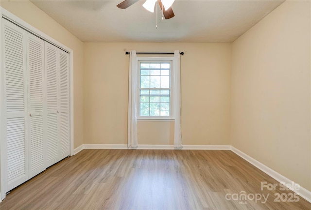 3043 Charles Rd, Shelby, NC 28152 - unfurnished bedroom with light wood finished floors, a closet, baseboards, and ceiling fan
