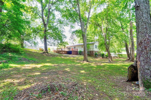 3043 Charles Rd, Shelby, NC 28152 - view of green lawn featuring a wooden deck