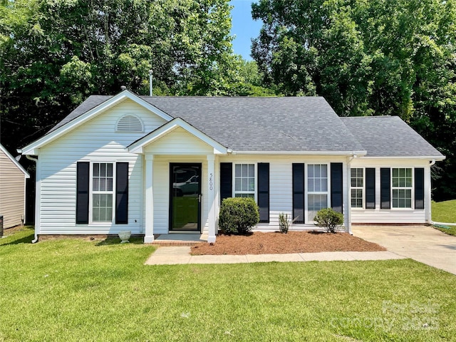 5800 Silver Eagle Dr, Charlotte, NC 28214 - view of front of home with a shingled roof and a front yard