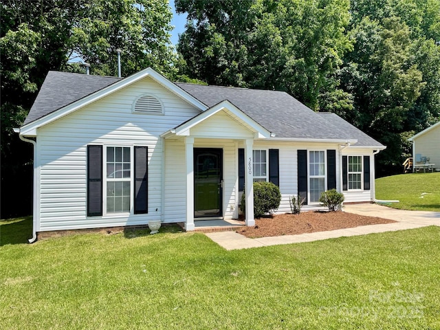 5800 Silver Eagle Dr, Charlotte, NC 28214 - view of front facade featuring a front lawn and roof with shingles