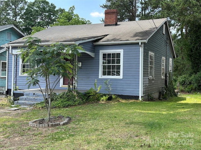 839 S Chester St, Gastonia, NC 28052 - view of front of home with a chimney, a front lawn, and roof with shingles