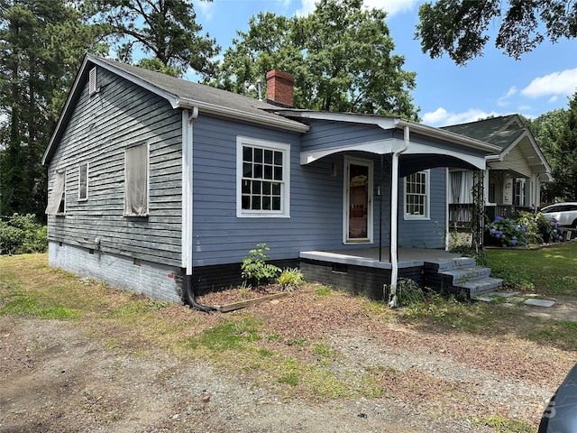 839 S Chester St, Gastonia, NC 28052 - view of front of home featuring a porch and a chimney