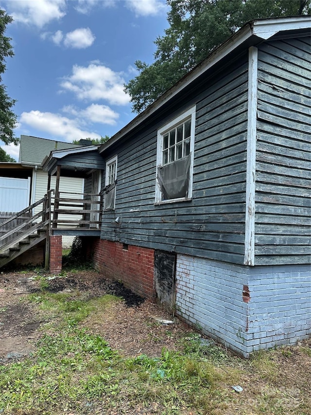 839 S Chester St, Gastonia, NC 28052 - view of side of home featuring stairway and crawl space