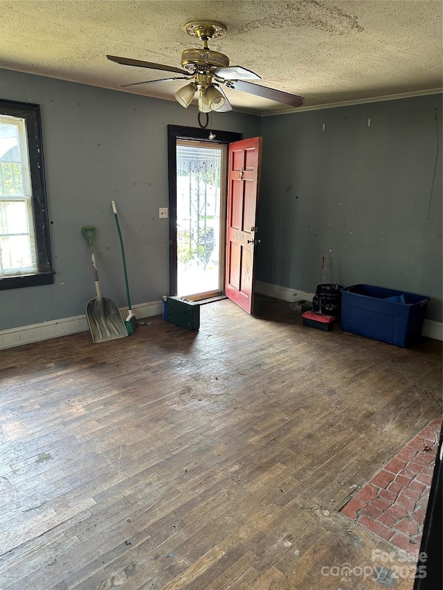 839 S Chester St, Gastonia, NC 28052 - entrance foyer with hardwood / wood-style flooring, a textured ceiling, a ceiling fan, and baseboards