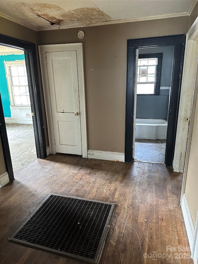 839 S Chester St, Gastonia, NC 28052 - hall with hardwood / wood-style floors, ornamental molding, healthy amount of natural light, and baseboards