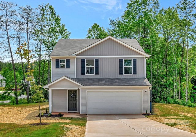 3305 Rian Dr, Lenoir, NC 28645 - view of front of home featuring an attached garage, concrete driveway, a shingled roof, and a front lawn