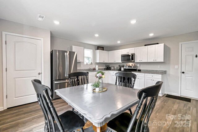 3305 Rian Dr, Lenoir, NC 28645 - dining area with dark wood finished floors, baseboards, and recessed lighting