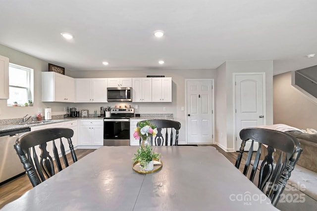 3305 Rian Dr, Lenoir, NC 28645 - dining space featuring dark wood-type flooring, recessed lighting, and baseboards