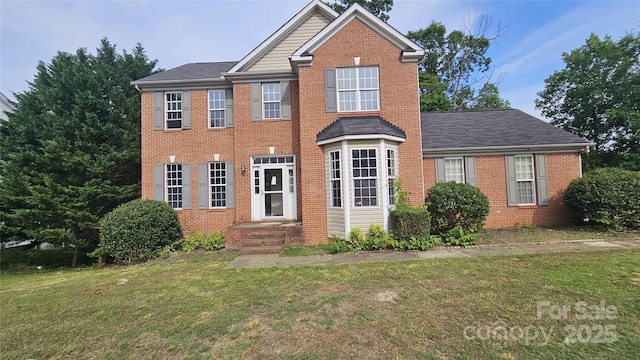 4227 Kiser Woods Dr SW, Concord, NC 28025 - view of front of home with brick siding and a front yard