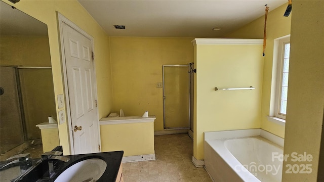 4227 Kiser Woods Dr SW, Concord, NC 28025 - full bath featuring vanity, a stall shower, a garden tub, and tile patterned flooring