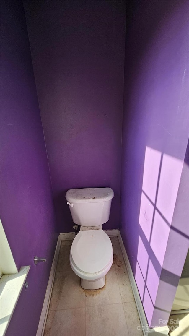 4227 Kiser Woods Dr SW, Concord, NC 28025 - bathroom featuring toilet, baseboards, and tile patterned floors
