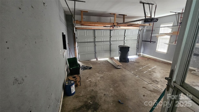 4227 Kiser Woods Dr SW, Concord, NC 28025 - garage featuring a garage door opener and baseboards