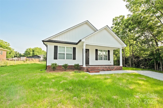 1028 Gibson St, Albemarle, NC 28001 - view of front of house featuring board and batten siding and a porch