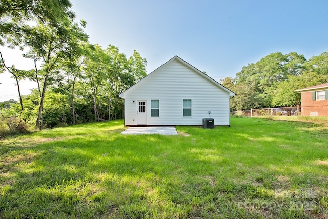 1028 Gibson St, Albemarle, NC 28001 - rear view of property featuring a patio, a yard, and cooling unit