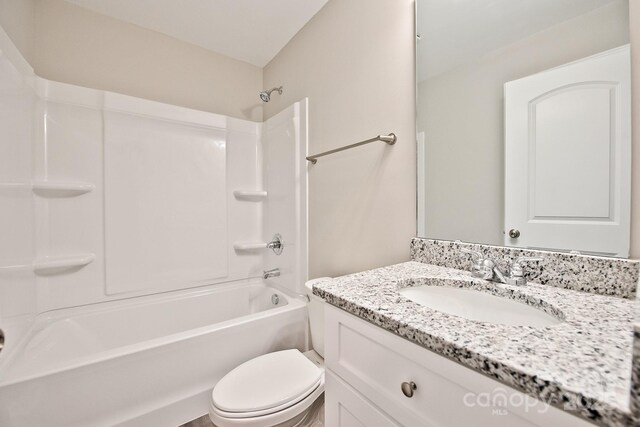 1028 Gibson St, Albemarle, NC 28001 - full bathroom featuring vanity, toilet, and bathing tub / shower combination