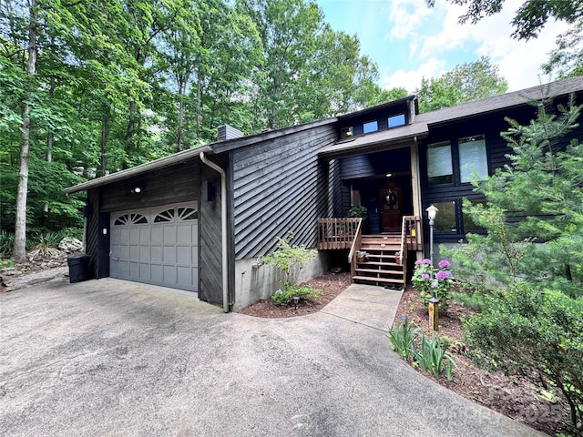 67 Cliffview Dr, Asheville, NC 28803 - view of front of house with a chimney and asphalt driveway