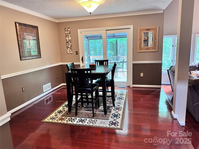 67 Cliffview Dr, Asheville, NC 28803 - dining room with baseboards, wood finished floors, crown molding, and a textured ceiling