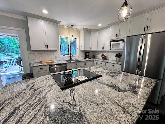 67 Cliffview Dr, Asheville, NC 28803 - kitchen featuring a sink, stainless steel appliances, pendant lighting, backsplash, and recessed lighting