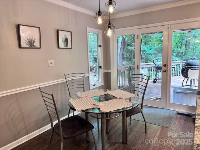 67 Cliffview Dr, Asheville, NC 28803 - dining area with wood finished floors, ornamental molding, and french doors
