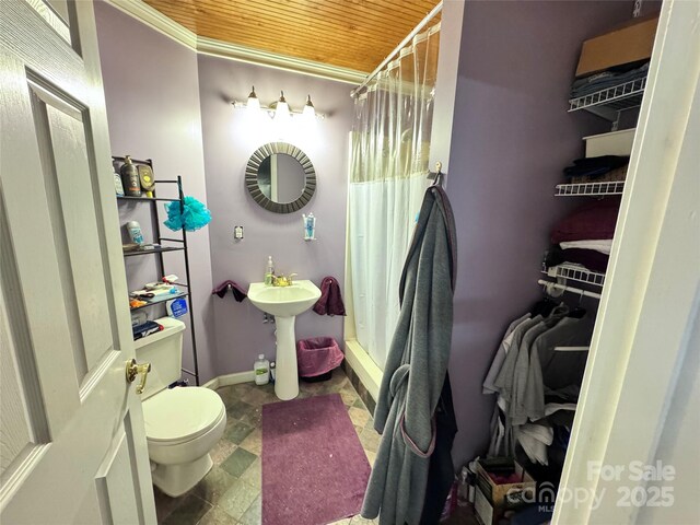 67 Cliffview Dr, Asheville, NC 28803 - full bath featuring wood ceiling, toilet, crown molding, baseboards, and shower / bath combination with curtain