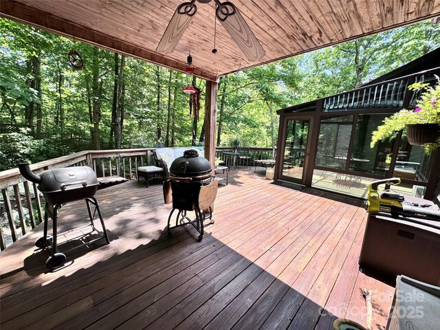 67 Cliffview Dr, Asheville, NC 28803 - wooden deck with grilling area, ceiling fan, and a sunroom