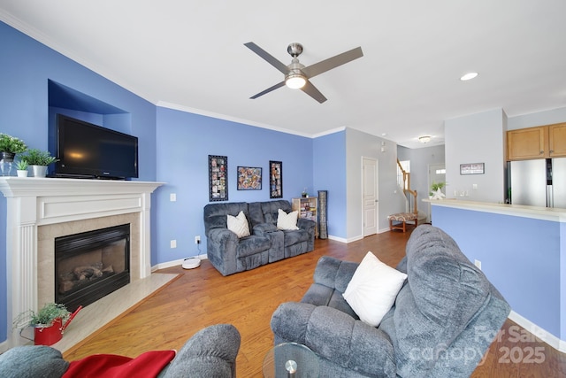 635 Brickdust Ct, Fort Mill, SC 29708 - living area featuring ceiling fan, wood finished floors, a tiled fireplace, crown molding, and recessed lighting