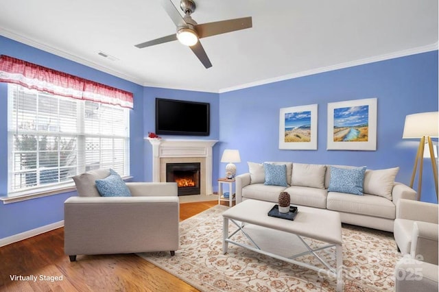 635 Brickdust Ct, Fort Mill, SC 29708 - living area featuring a ceiling fan, crown molding, wood finished floors, and a fireplace with flush hearth