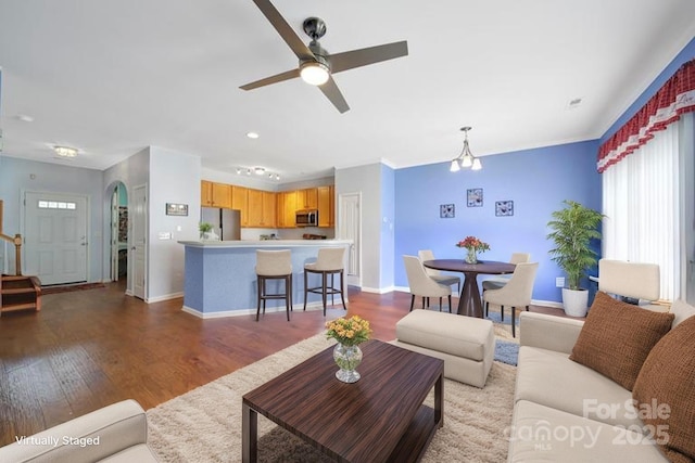 635 Brickdust Ct, Fort Mill, SC 29708 - living room with dark wood-type flooring, ceiling fan, arched walkways, and recessed lighting