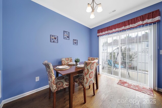 635 Brickdust Ct, Fort Mill, SC 29708 - dining space with wood finished floors and a chandelier