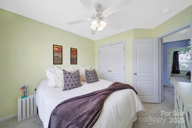 635 Brickdust Ct, Fort Mill, SC 29708 - bedroom with light carpet, ceiling fan, a closet, and radiator heating unit