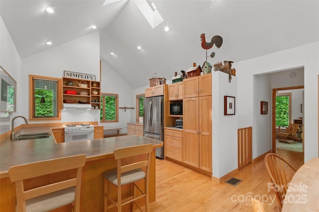 608 Brandywine Rd, Waynesville, NC 28786 - kitchen with a sink, freestanding refrigerator, gas range, high vaulted ceiling, and open shelves