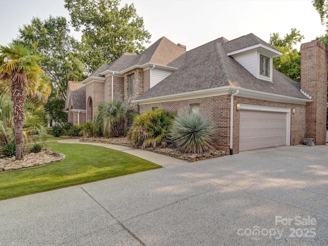 15708 Eagleview Dr, Charlotte, NC 28278 - traditional-style house with brick siding, concrete driveway, a shingled roof, a front yard, and a garage