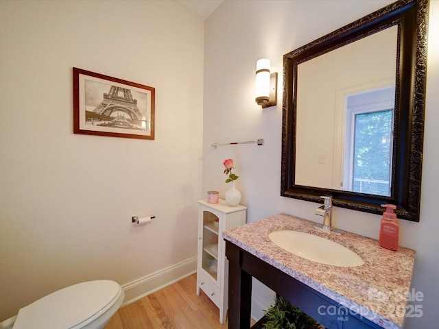 15708 Eagleview Dr, Charlotte, NC 28278 - half bath with wood finished floors, baseboards, toilet, and vanity