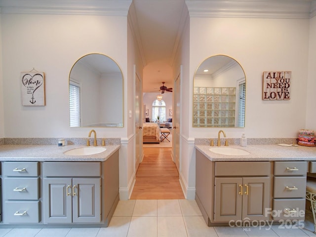 15708 Eagleview Dr, Charlotte, NC 28278 - bathroom featuring two vanities, crown molding, ensuite bath, ceiling fan, and tile patterned floors