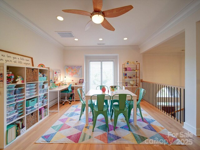 15708 Eagleview Dr, Charlotte, NC 28278 - dining area featuring wood finished floors, ornamental molding, a ceiling fan, and recessed lighting
