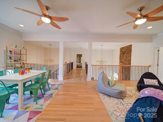 15708 Eagleview Dr, Charlotte, NC 28278 - playroom with a ceiling fan, wood finished floors, crown molding, recessed lighting, and a chandelier