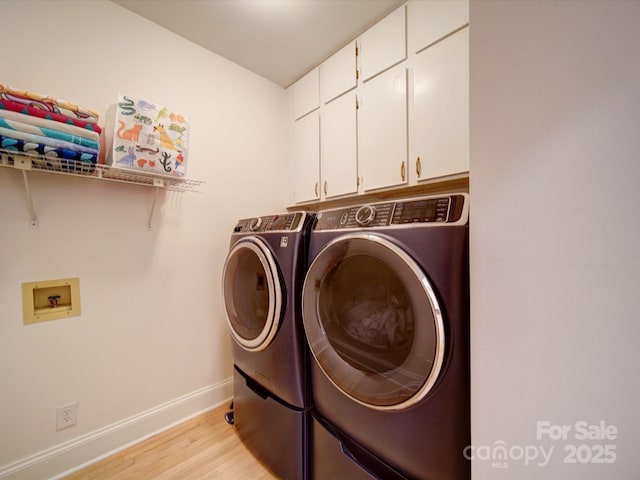15708 Eagleview Dr, Charlotte, NC 28278 - laundry room featuring cabinet space, light wood-style flooring, baseboards, and washer and dryer