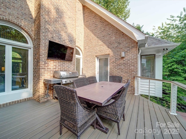 15708 Eagleview Dr, Charlotte, NC 28278 - wooden deck featuring grilling area and outdoor dining space