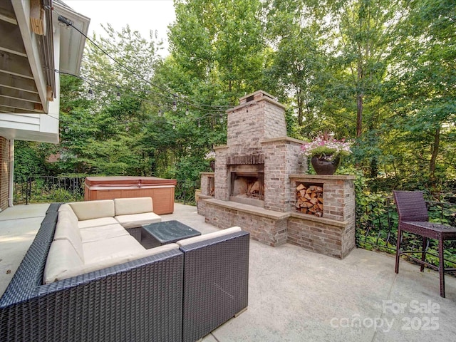 15708 Eagleview Dr, Charlotte, NC 28278 - view of patio / terrace with a hot tub, an outdoor living space with a fireplace, and view of wooded area