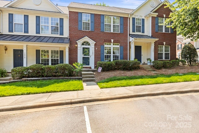 7881 Mariners Pointe Cir, Denver, NC 28037 - multi unit property featuring a standing seam roof, brick siding, a metal roof, and uncovered parking