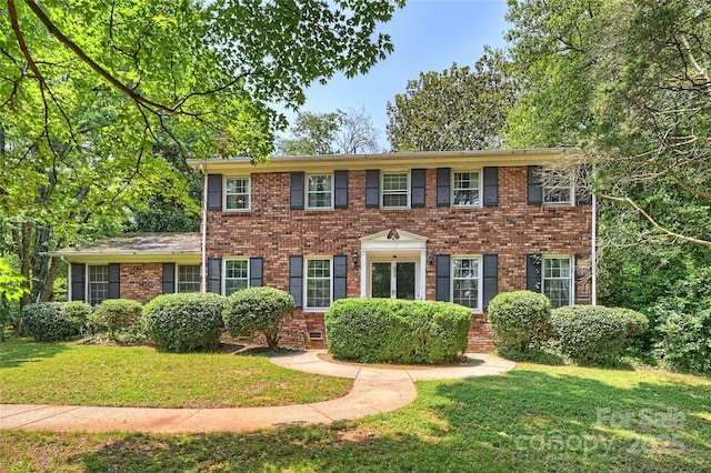 6434 Sardis Rd, Charlotte, NC 28270 - colonial house featuring a front lawn and brick siding