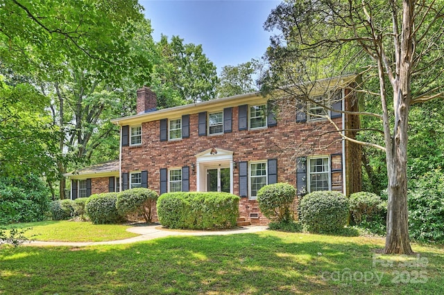 6434 Sardis Rd, Charlotte, NC 28270 - colonial house featuring a chimney, brick siding, and a front yard