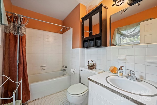 6434 Sardis Rd, Charlotte, NC 28270 - full bath featuring shower / bath combo with shower curtain, tile patterned floors, toilet, vanity, and tile walls