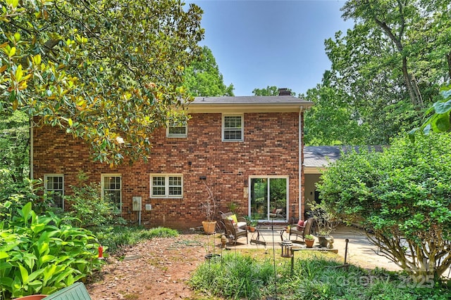 6434 Sardis Rd, Charlotte, NC 28270 - rear view of property featuring a patio area, a chimney, and brick siding