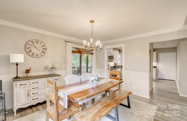 110 Spring Path, Hendersonville, NC 28739 - dining room featuring a chandelier, ornamental molding, and light wood-style flooring